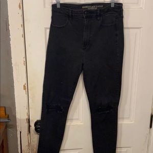 Black high rise skinny jeans knee slit